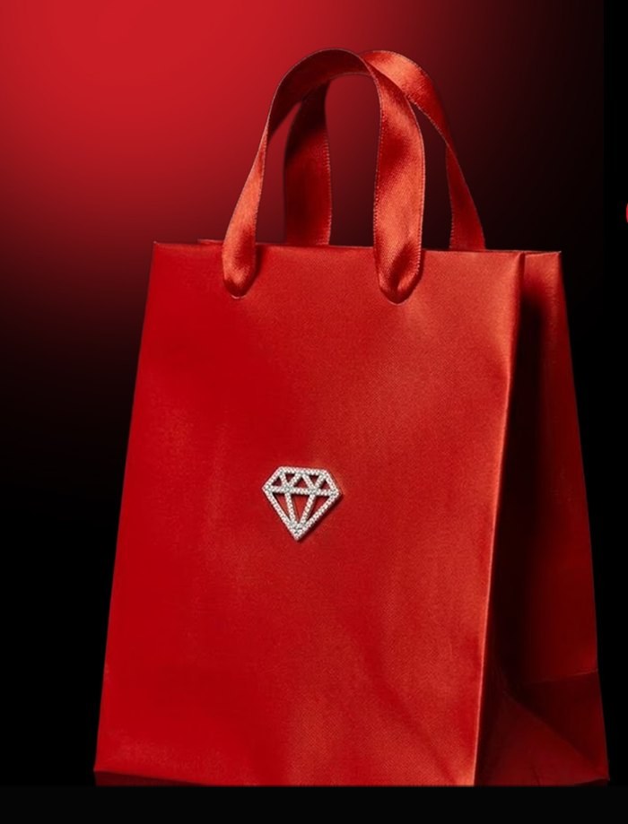 Red jewelry gift bag with a diamond emblem